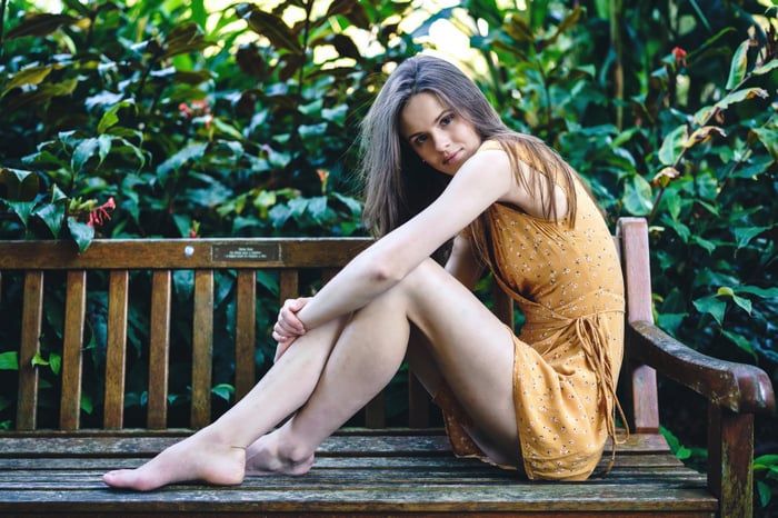 Girl on a bench in a garden