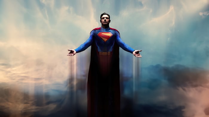 Superman flying with arms outstretched in the sky