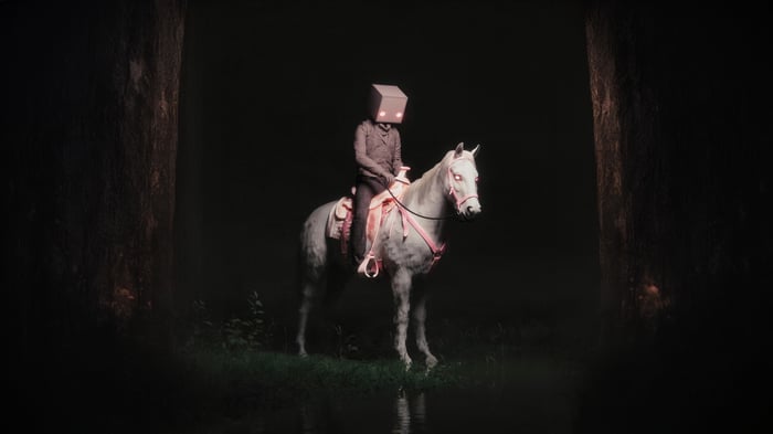 Person with box head riding a white horse