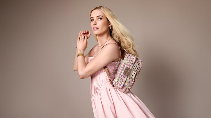 Emma Roberts in a pink dress with a Fendi bag
