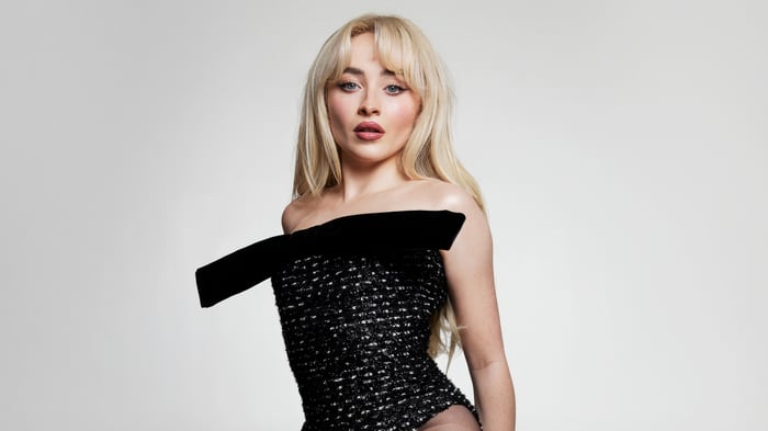 Sabrina Carpenter in a black sparkly dress