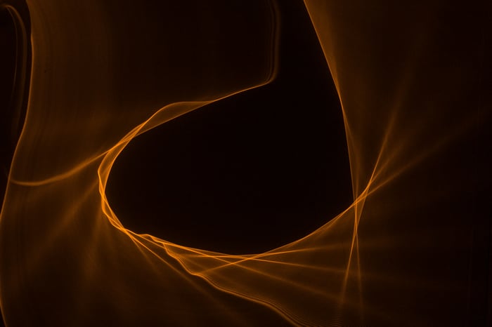 Orange light trails forming a circular shape