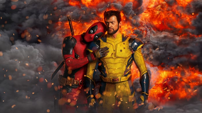 Deadpool and Wolverine in front of an explosion