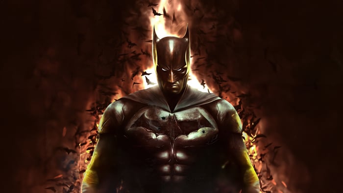 Batman surrounded by bats and fire
