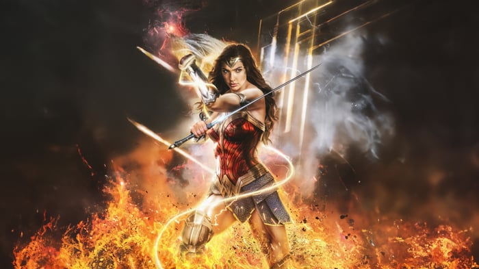 Wonder Woman in battle with sword and fire