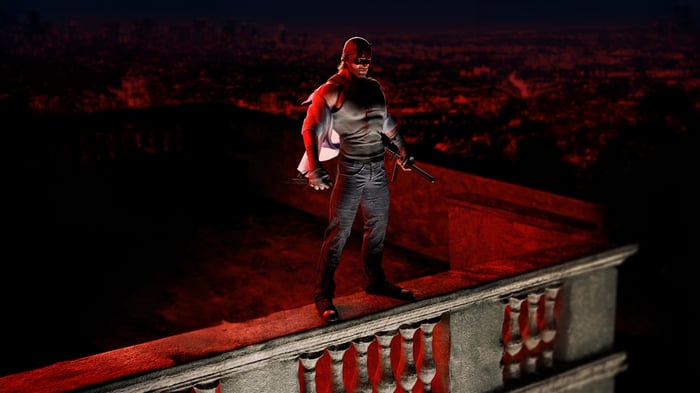 Daredevil standing on a rooftop overlooking a city