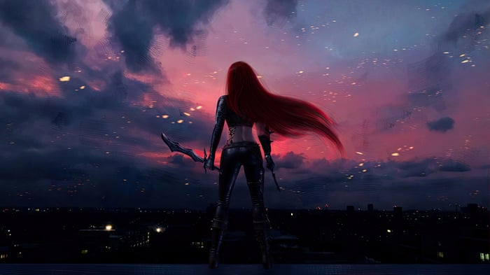 Katarina standing on a rooftop at sunset