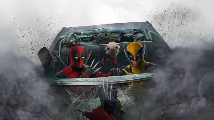 Deadpool, Wolverine, and Dogpool in a wrecked car