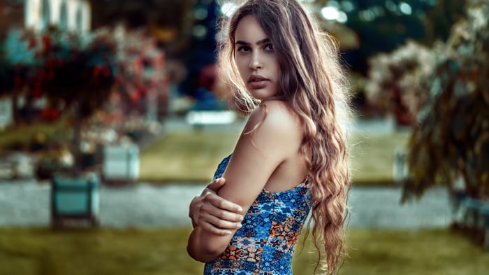 Girl with arms crossed and flowing hair