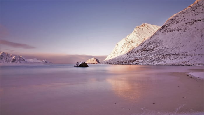 Haukland Beach Sunrise with Snow-Capped Mountains