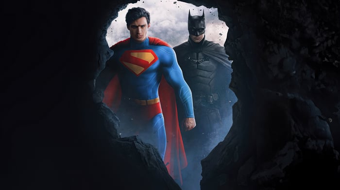 Superman and Batman emerge from a cave