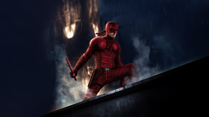 Daredevil in a red suit on a rooftop