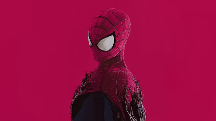 Spider-Man stands against a pink background