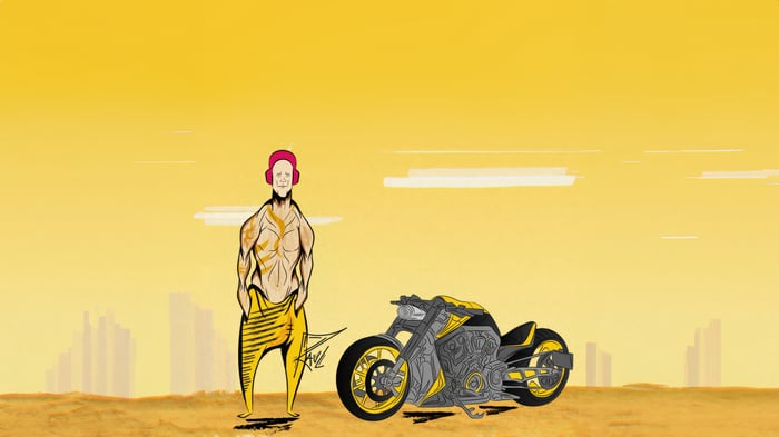 Muscular man with headphones and motorcycle in desert