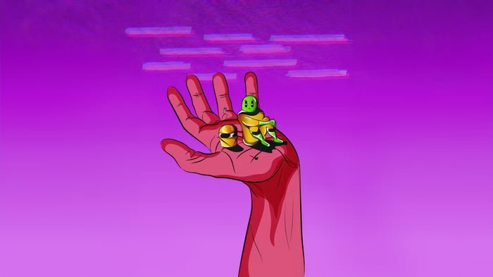 Alien and Helmet on a Hand