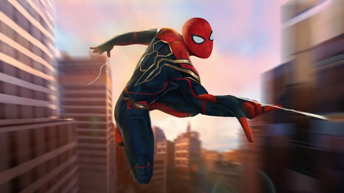 Spider-Man in his Hybrid Suit swings through a city