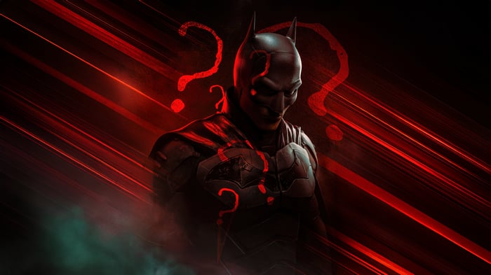 The Batman with Riddler symbols