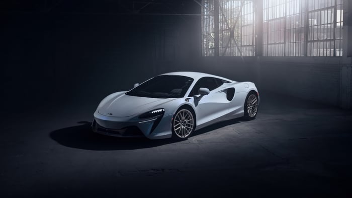 White McLaren Artura in a dimly lit garage