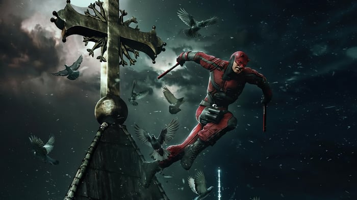 Daredevil on a church rooftop with pigeons