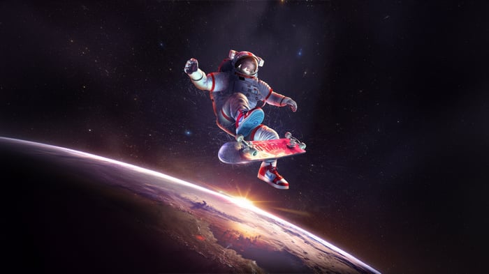 Astronaut skateboarding in space over Earth