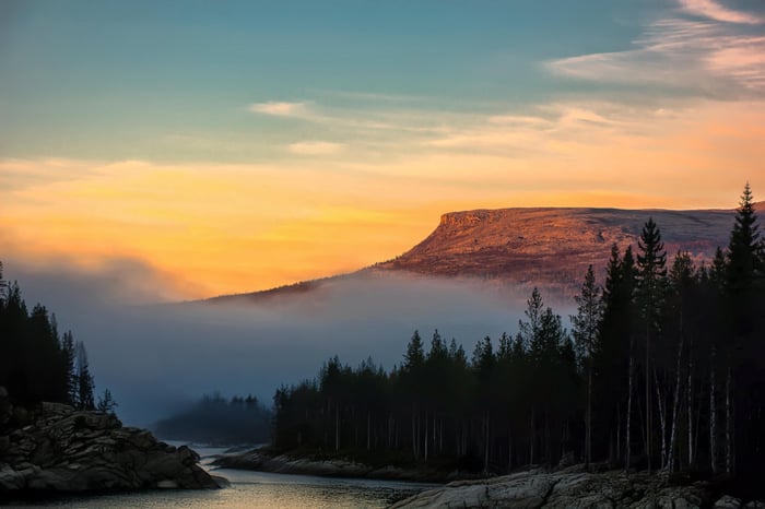 Early Morning Fog Over Mountain Lake in Northern Norway