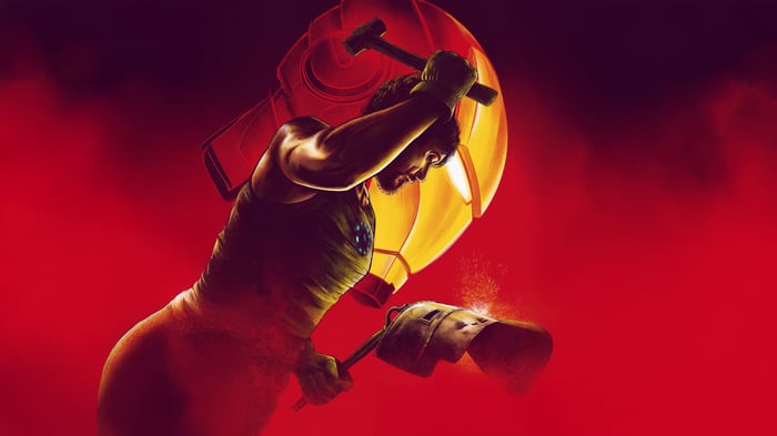 Tony Stark forging Iron Man armor