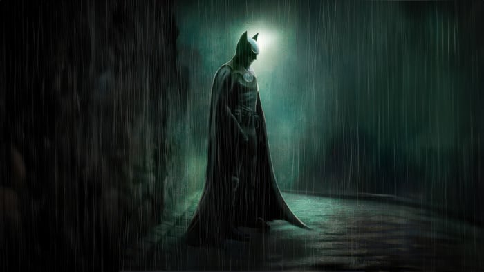 Batman standing in the rain