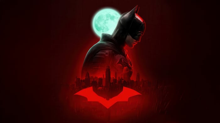 The Batman with Red Bat Symbol and Cityscape