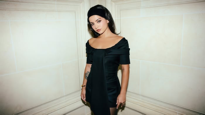 Isabela Merced in a black dress