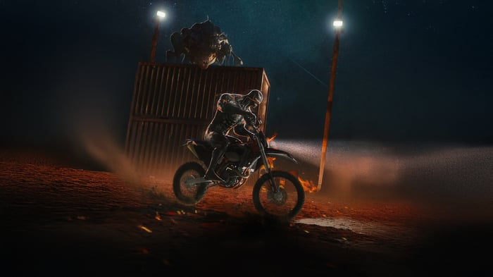 Venom riding a dirt bike at night