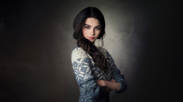 Girl with braided hair wearing a sweater