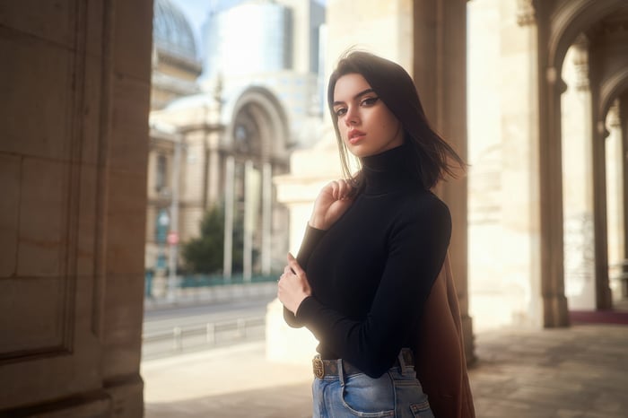 Woman in black turtleneck and jeans outdoors