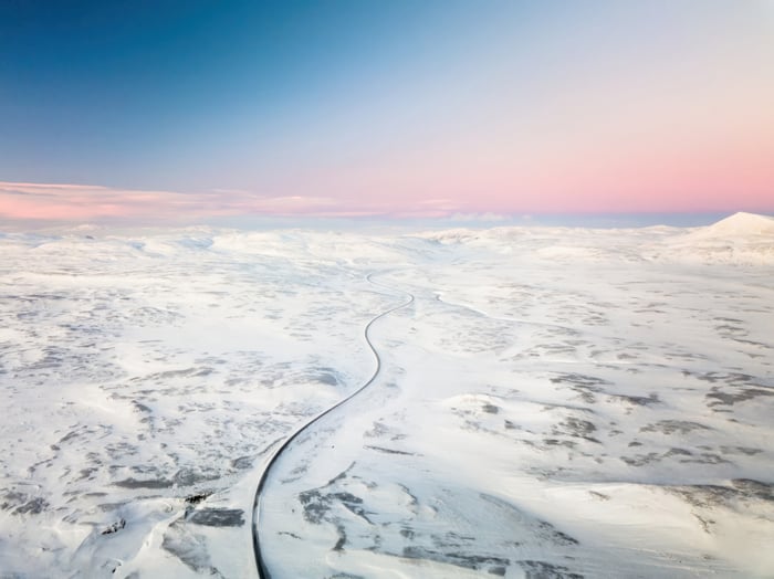 Road through snowy landscape in Iceland