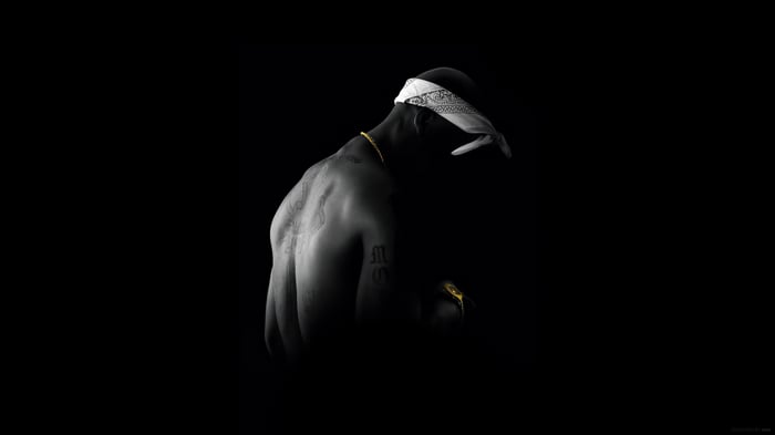 Tupac Shakur with bandana and gold chain
