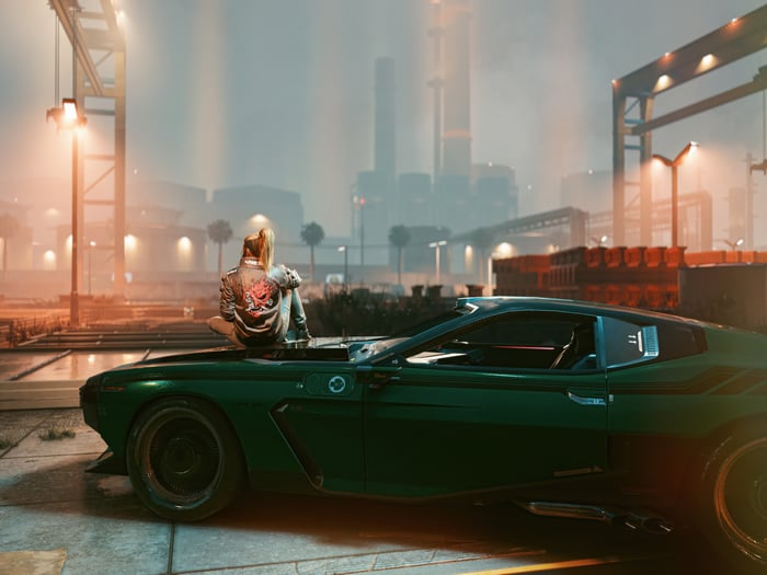 Cyberpunk 2077: Woman on a car in industrial area