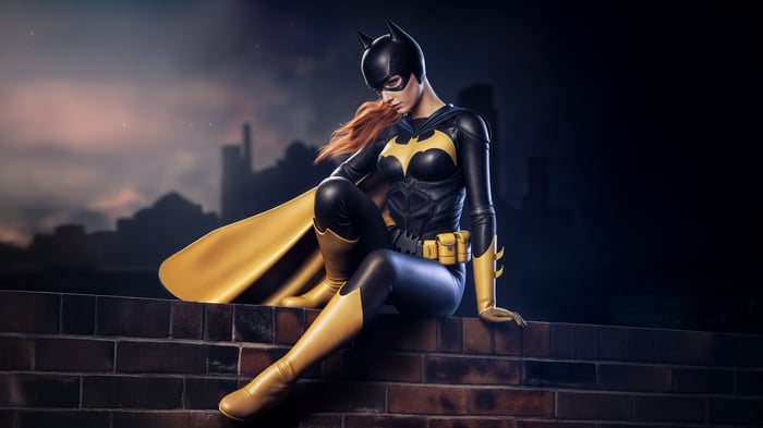 Batgirl Sitting on a Ledge at Night