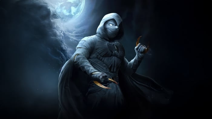 Moon Knight holding crescent darts