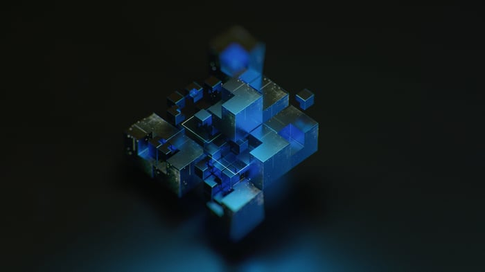 Abstract blue geometric cubes on a dark background