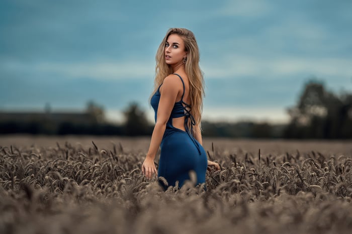 Girl in Blue Dress in a Field