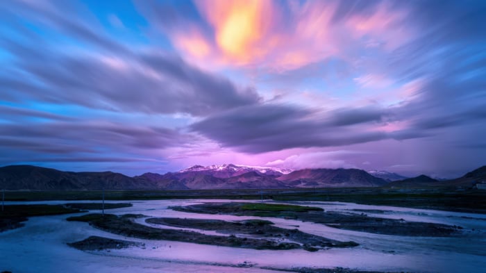 Long Exposure of Snowy Peaks at Sunset
