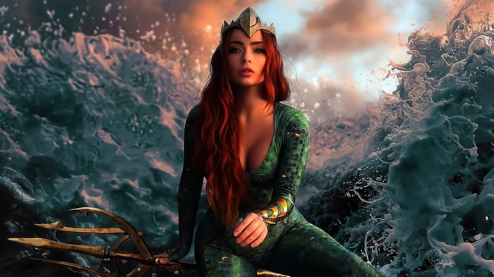 Mera from Aquaman sitting in the ocean with a trident