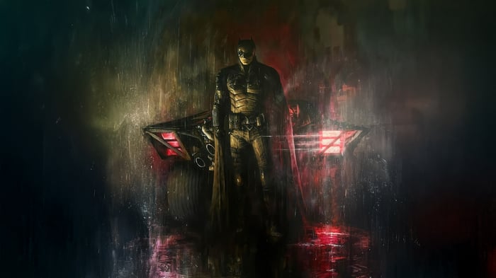 Batman and his Batmobile in the rain