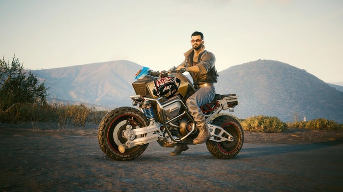 Man on a motorcycle in a desert landscape