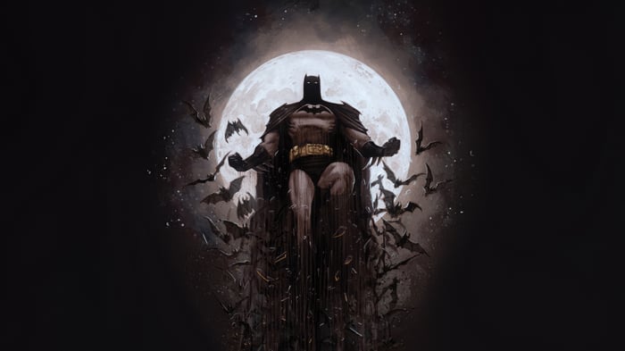 Batman surrounded by bats in front of a full moon