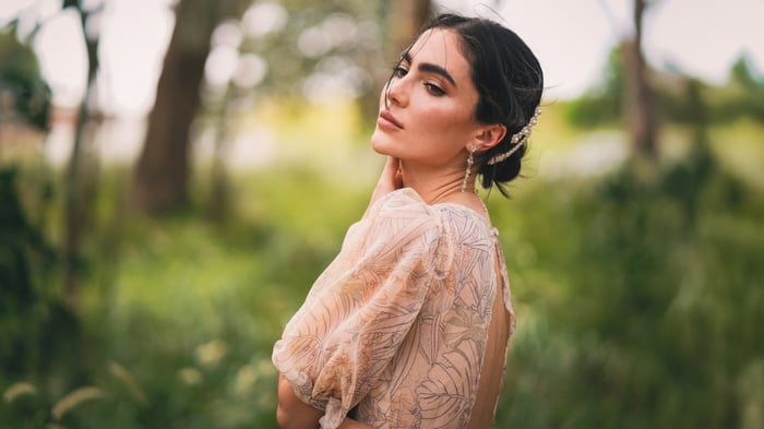 Claudia in a light dress outdoors