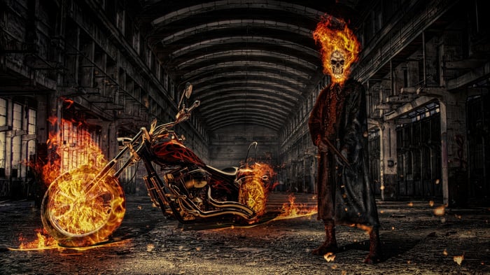 Ghost Rider and his flaming motorcycle in an abandoned factory