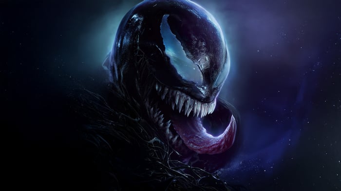 Venom's menacing face with sharp teeth and tongue