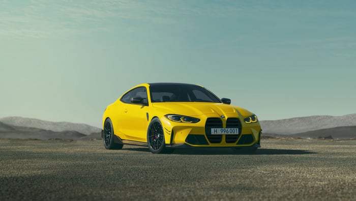 Yellow 2024 BMW M4 Coupe in Desert Landscape