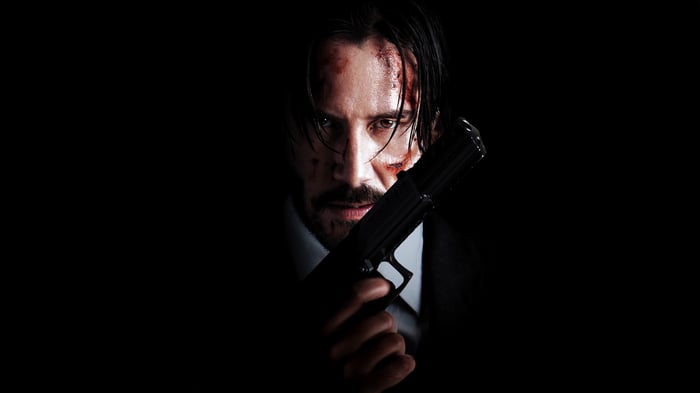 John Wick holding a gun