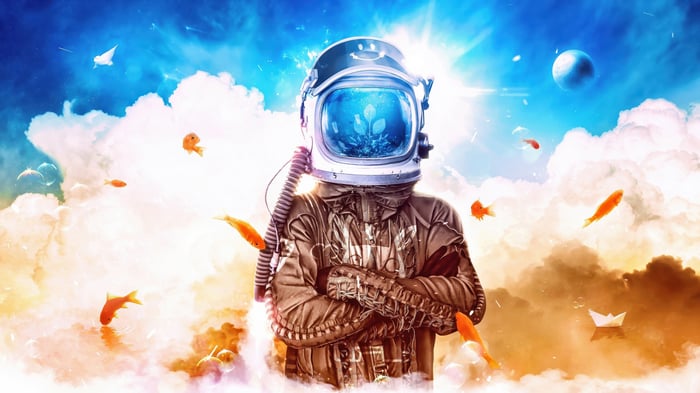 Astronaut with fish in helmet in clouds
